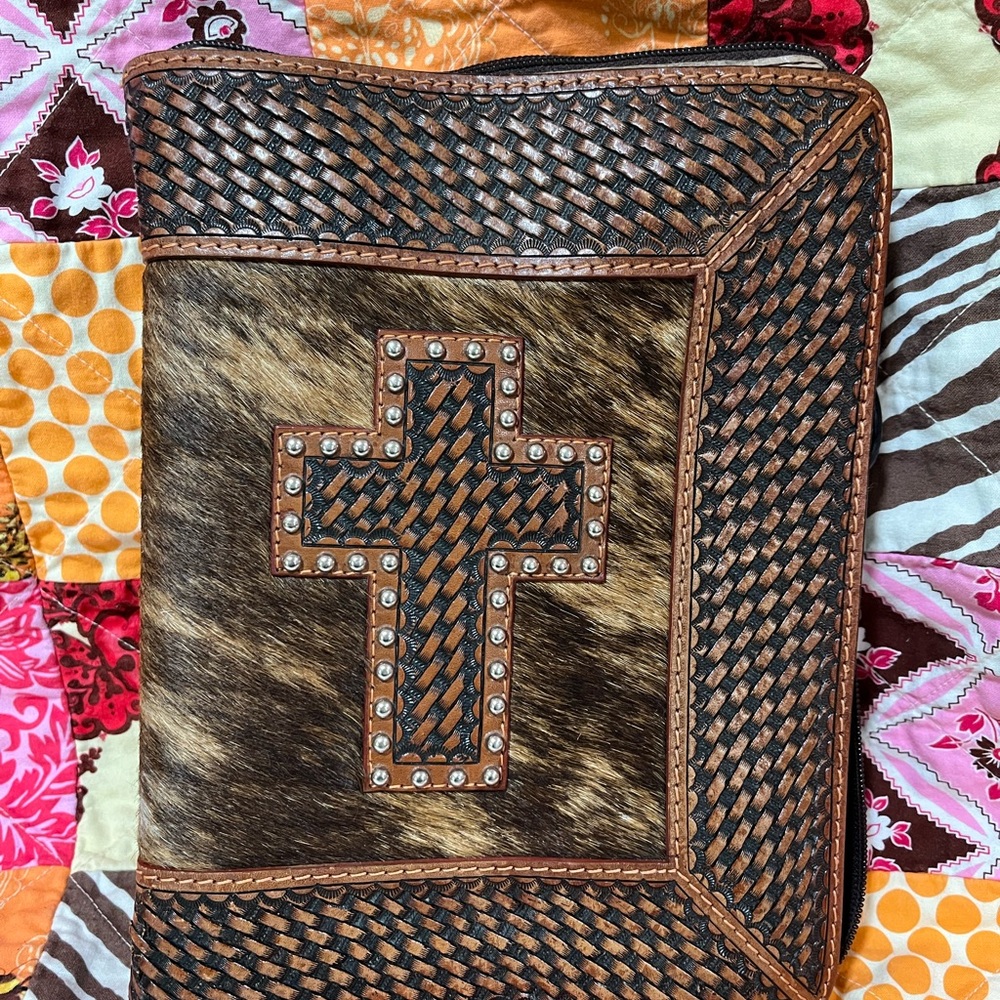 Embossed leather book cover with cross